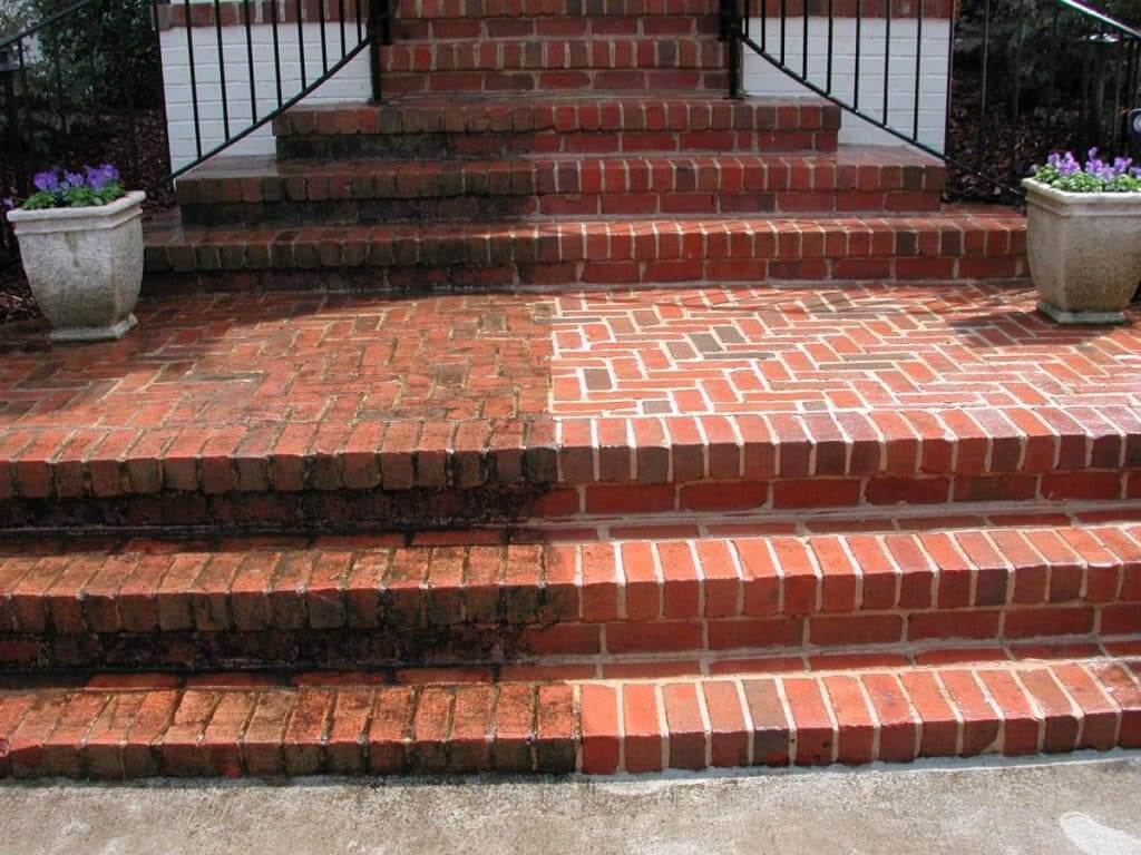 Brick stair pressure washing with half cleaned step comparison