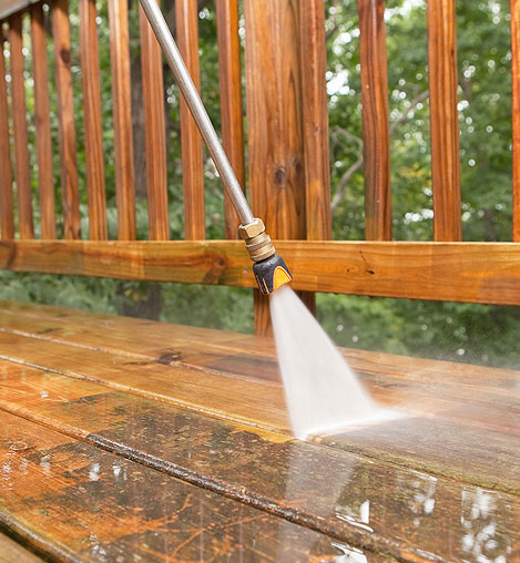 Wooden deck cleaning during pressure washing photo one