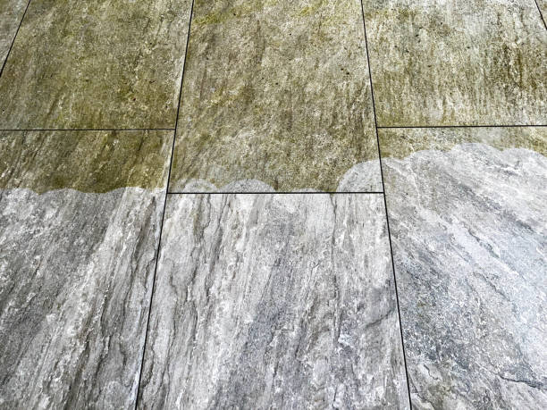 Tile floor pressure washing during mid cleaning stage