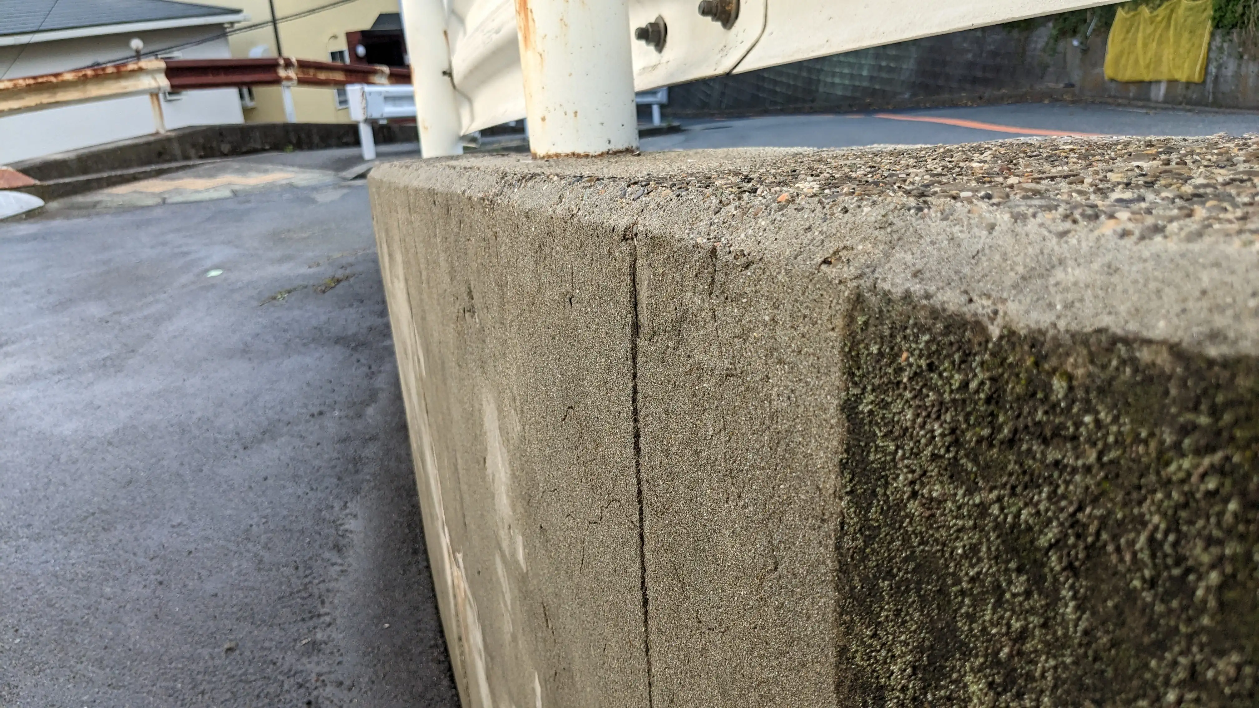Concrete wall and ramp pressure washing before and after during cleaning